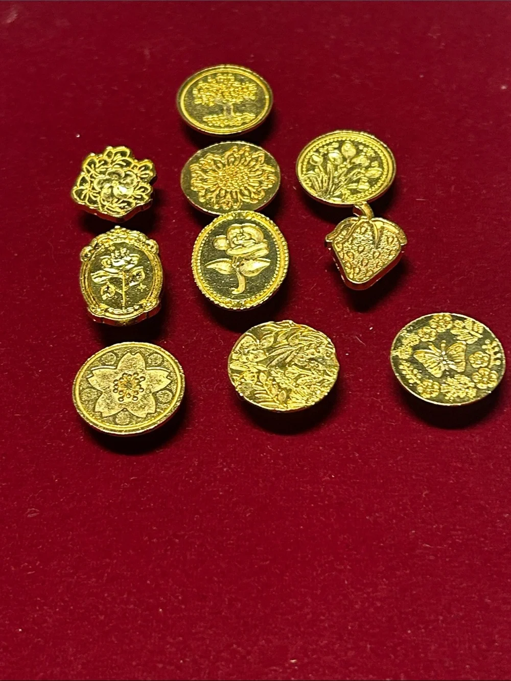 This is a set of 10 golden-toned metal wax seal stamps featuring various botanic